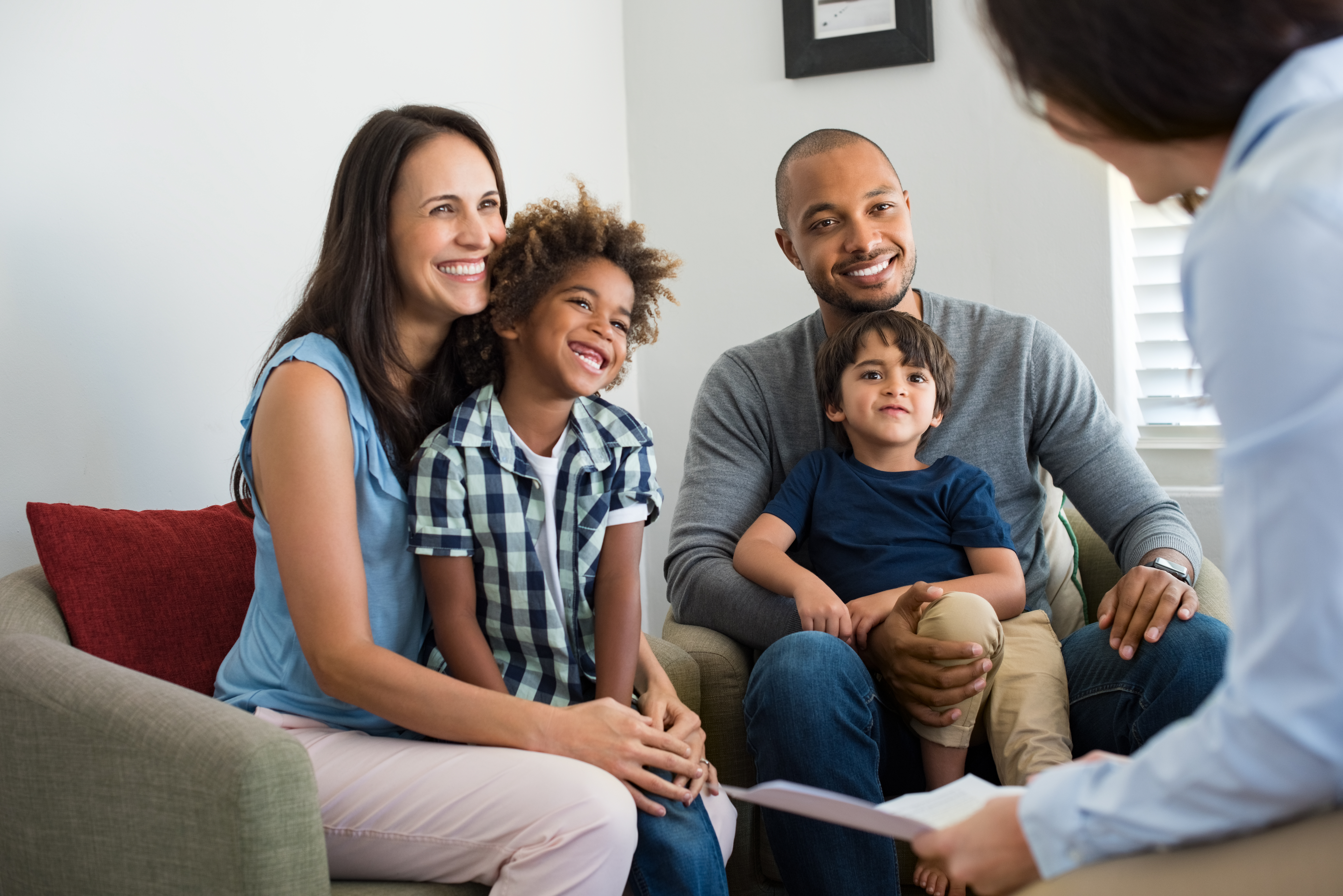 Happy mixed ethnicity family with two young children