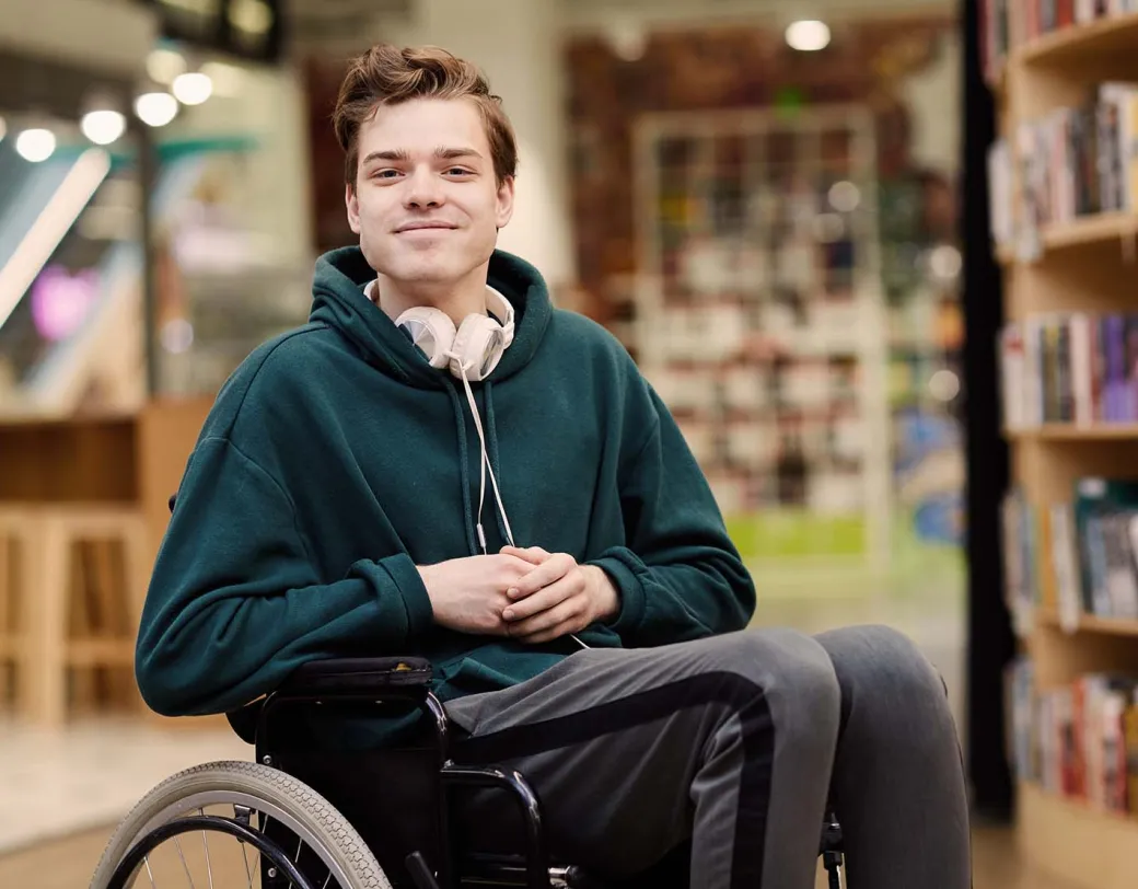 Person in wheelchair at a library.