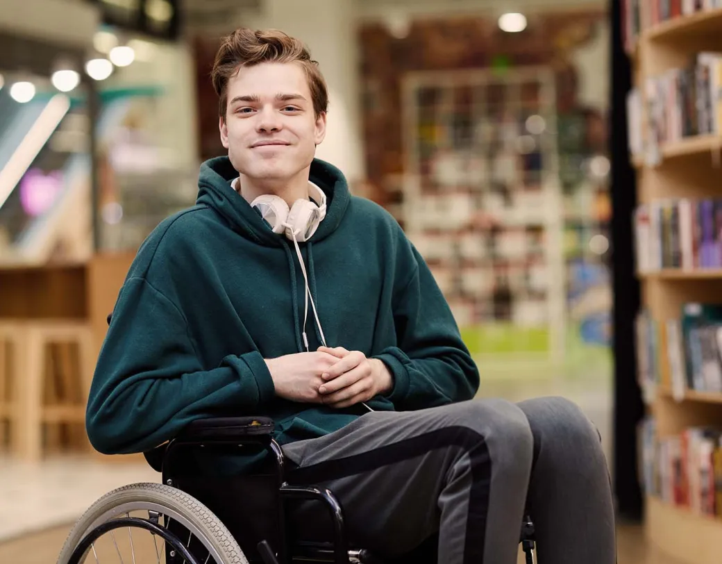 Person in wheelchair at a library.