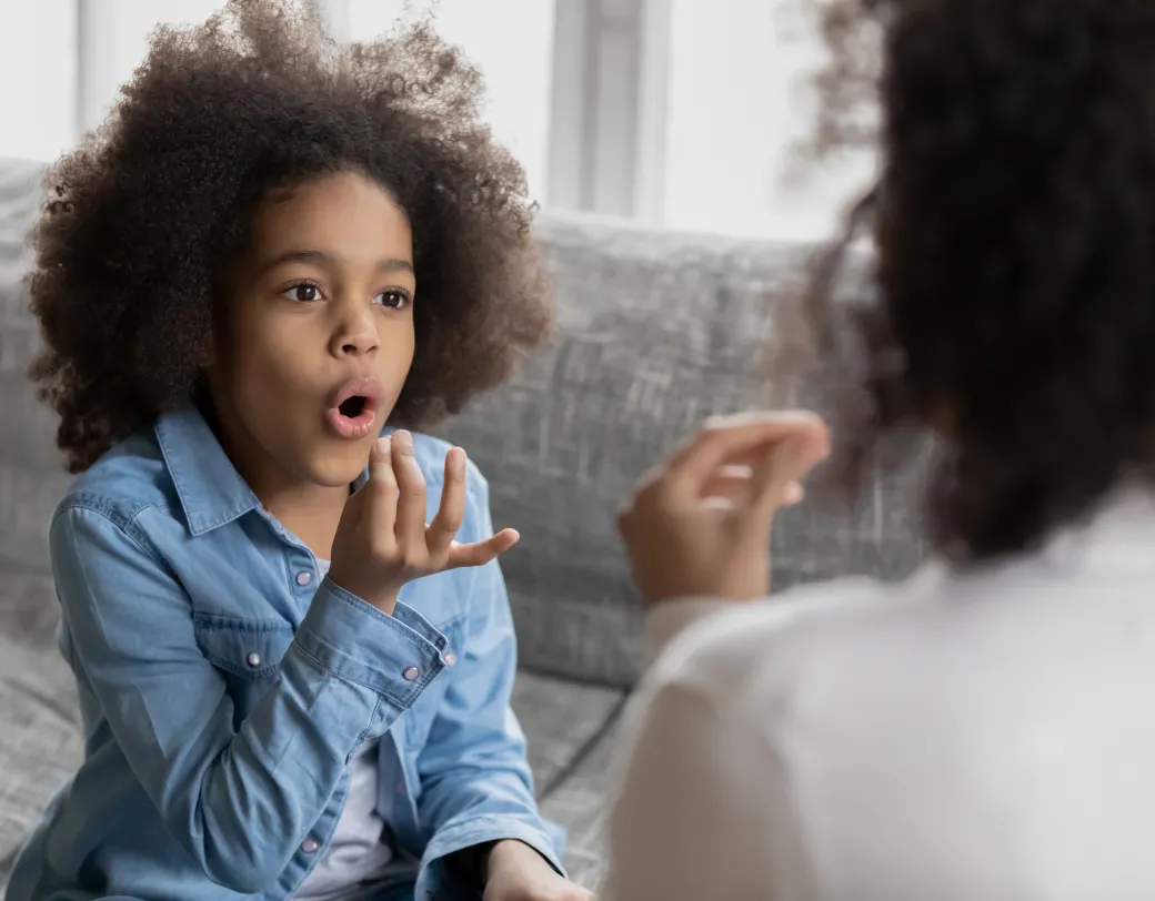 Speech-Language pathologist working with a young girl