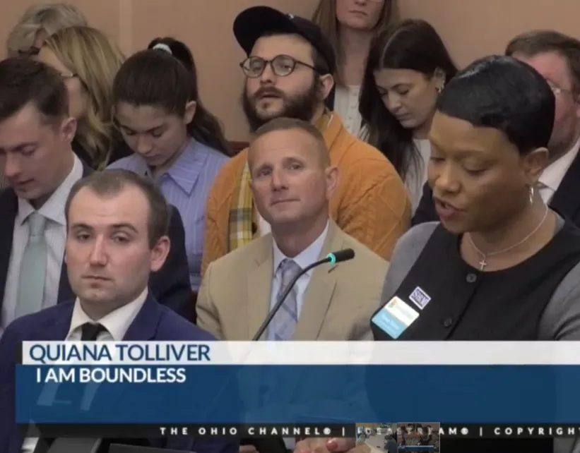 Quiana giving a testimony on TV