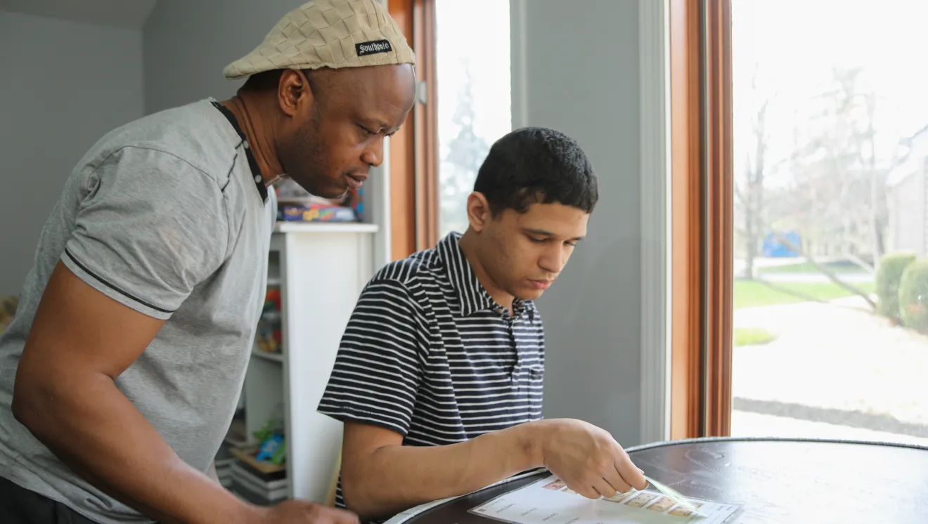 A DSP works with a young man on his lesson