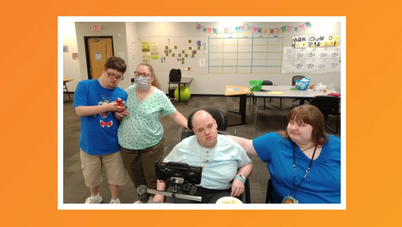 Four friends pose for a picture together. 