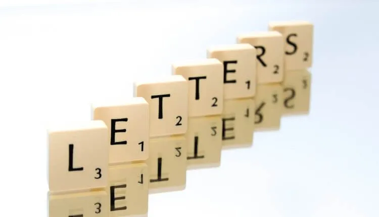 scrabble tiles spelling letters 