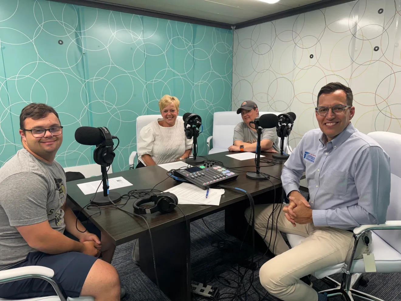 Photo of moderator Scott Light and guests Beth and Will Gibson with Tracie Reddy