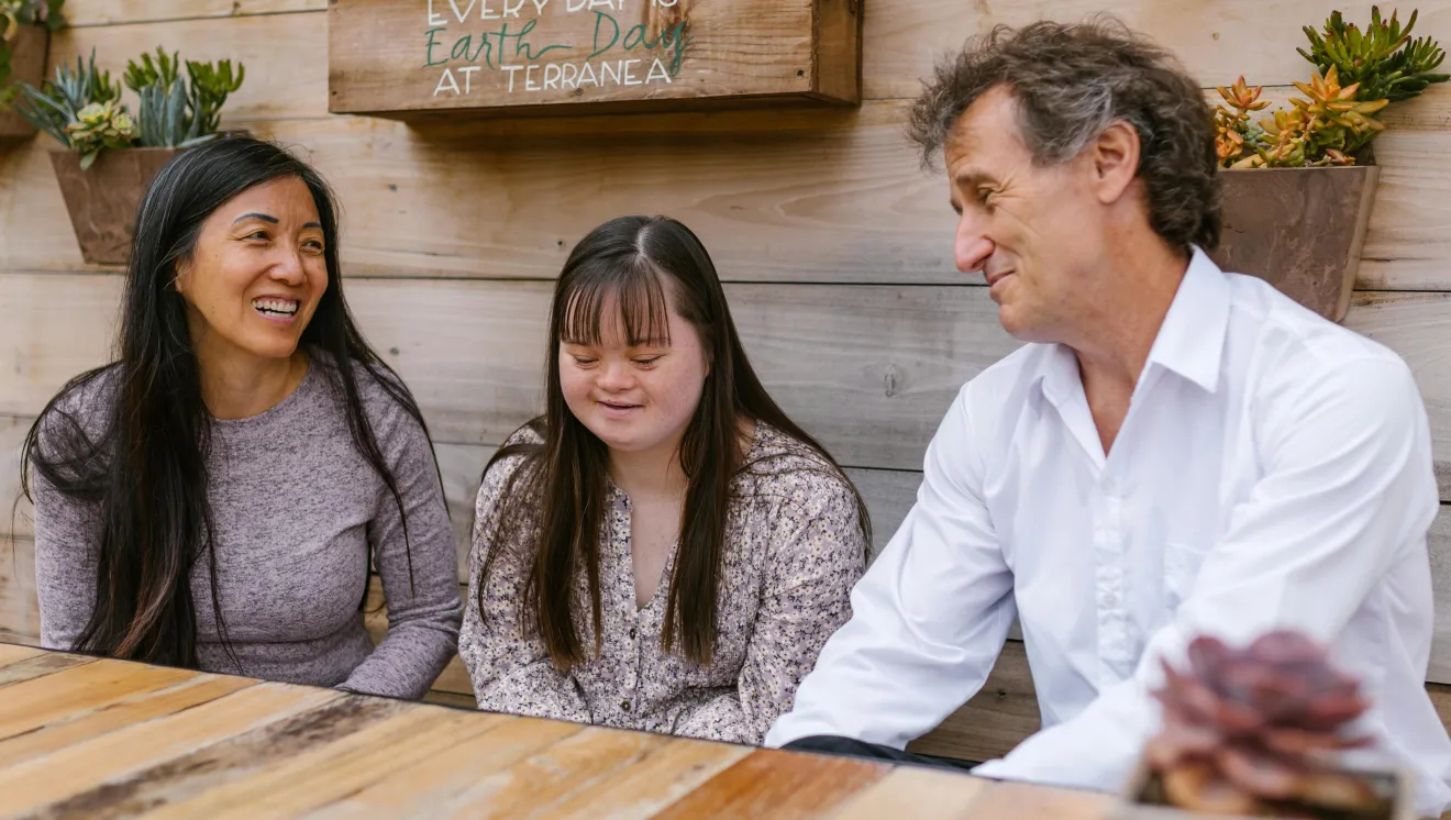 A family of 3 at a table