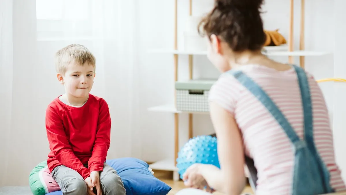 therapist working with autistic child