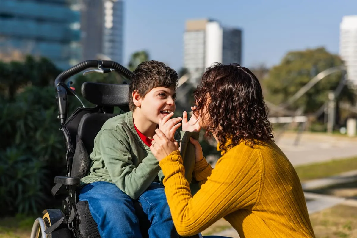 child with intellectual and developmental disability in stroller with mother