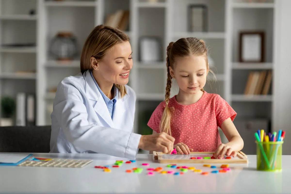 therapist working with autistic child
