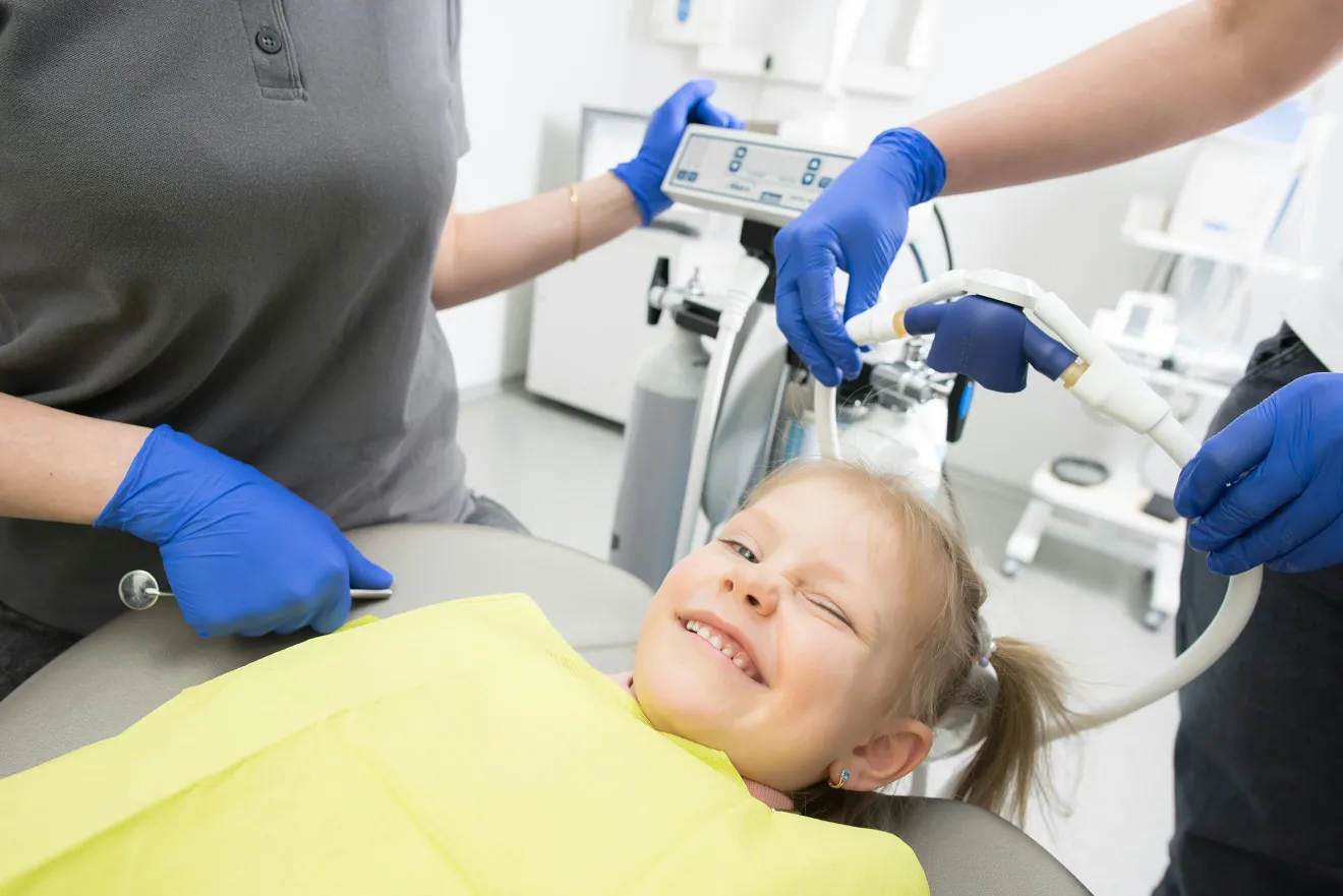 Child Smiling in Dental Chair