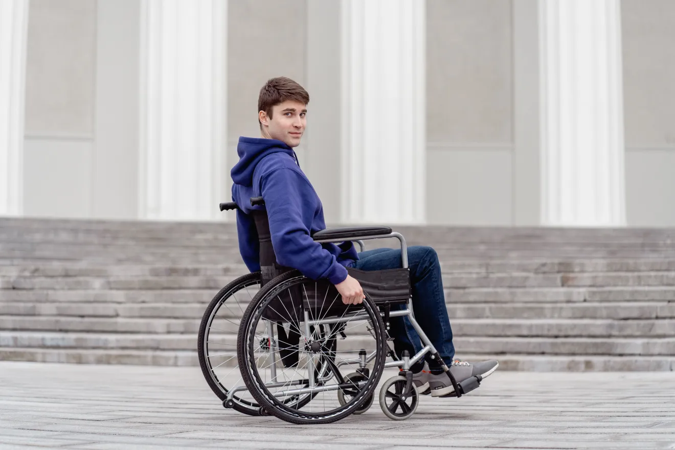 man in wheelchair outside the capitol building