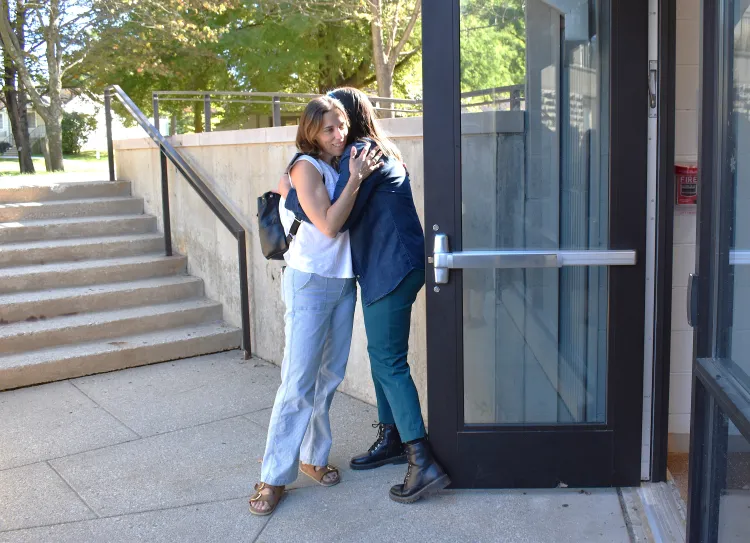 Two people hugging on the Worthington Boundless Campus